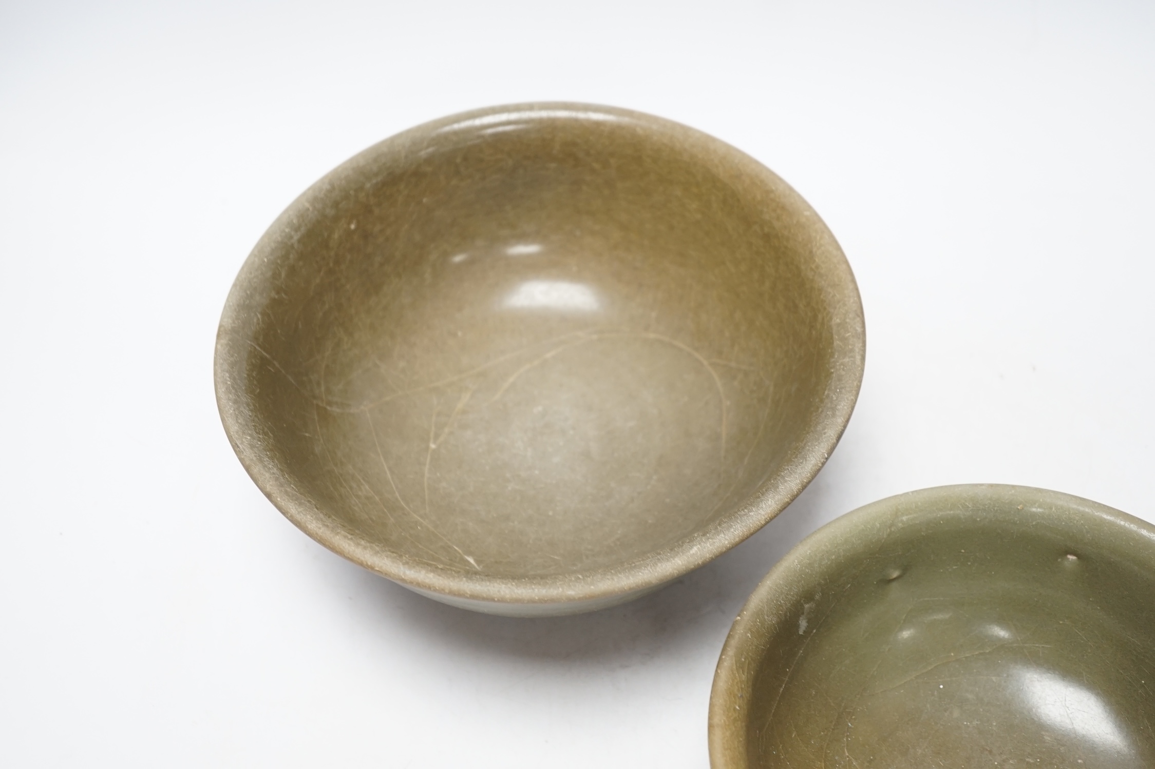 Two Chinese celadon bowls, Yuan-Ming dynasty, largest 22.5cm diameter